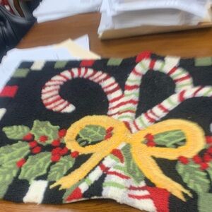 Festive Holiday Rug with Candy Cane and Bow Design